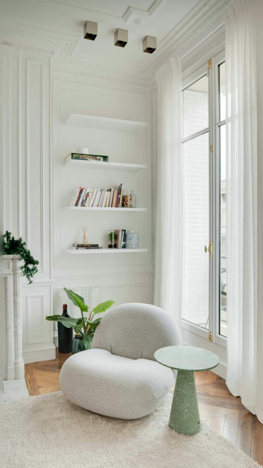 Sophisticated white living room with modern furniture and decor.